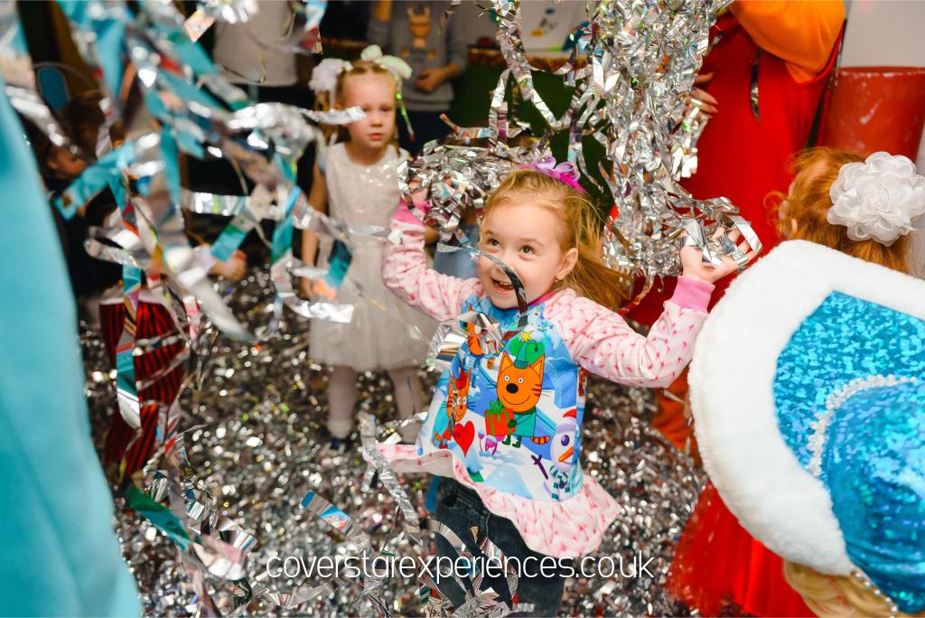 A photo of a girl having fun at a birthday party