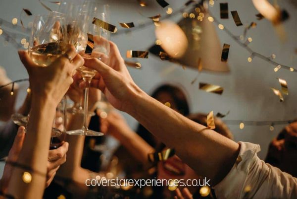 A photo of people toasting with glasses