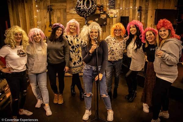 A photo of a group of ladies singing